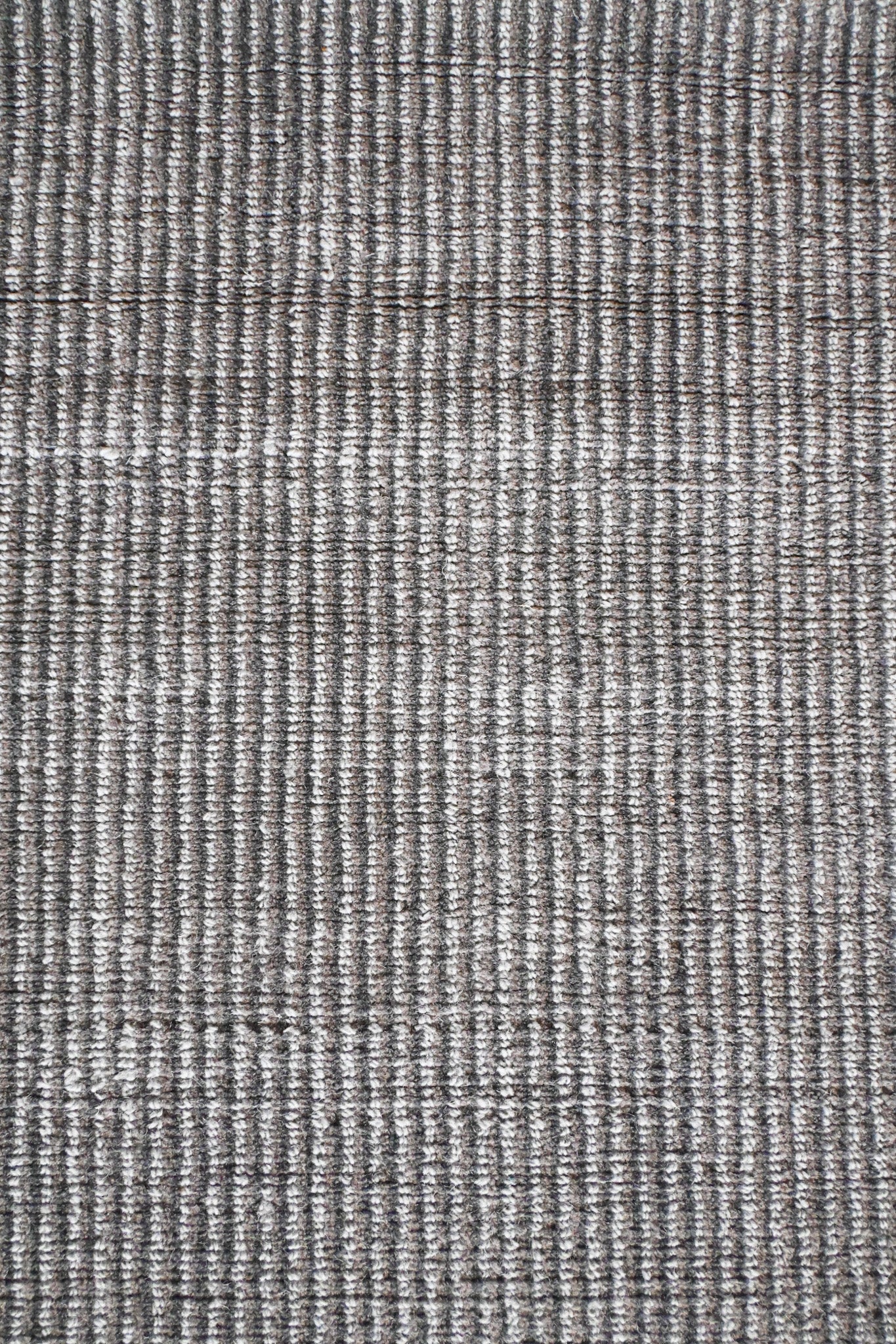 Textura suave y uniforme de la alfombra Duna en detalle