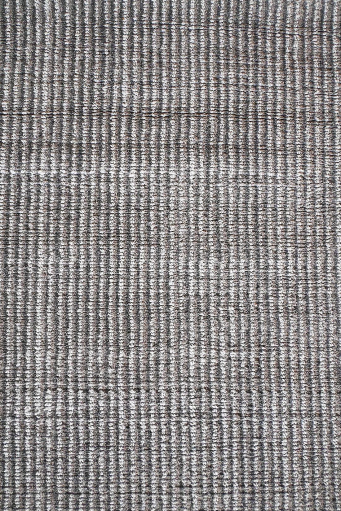 Textura suave y uniforme de la alfombra Duna en detalle